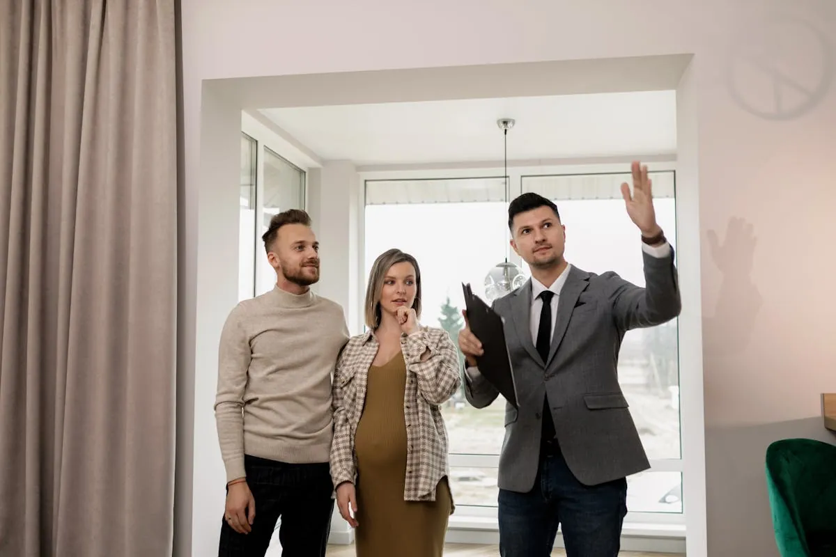 Real Estate - agent showing property to couple